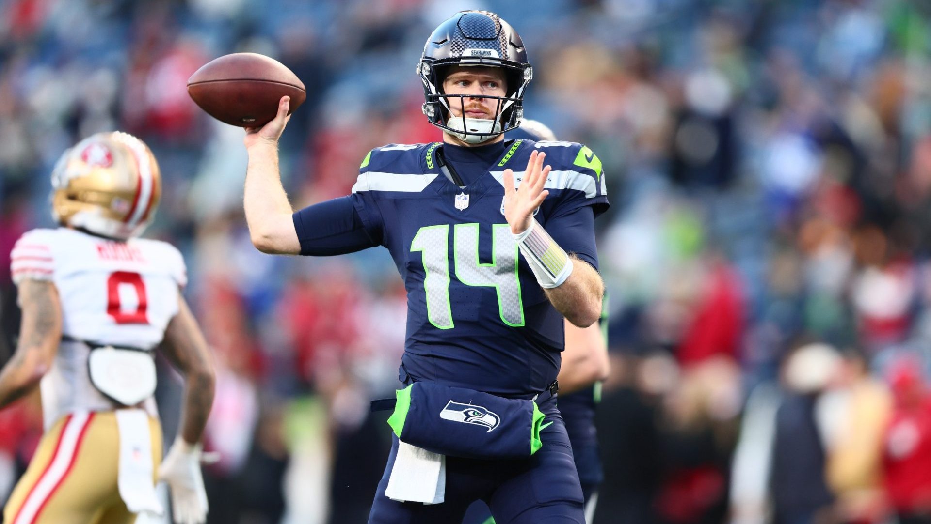 Jan 17, 2026; Seattle, WA, USA; Seattle Seahawks quarterback Sam Darnold (14) warms up prior to a game against the San Francisco 49ers in an NFC Divisional Round game at Lumen Field
