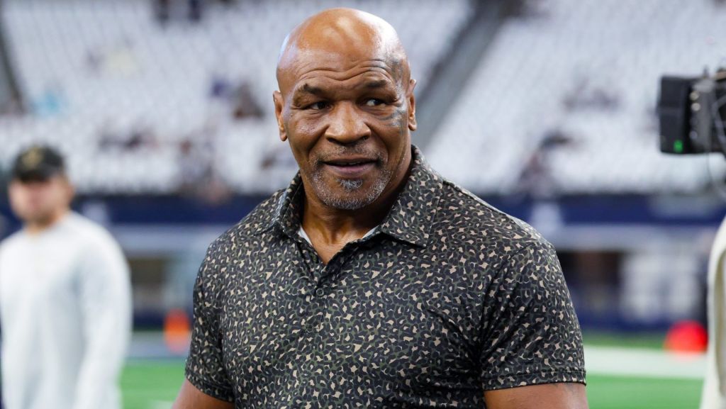 Sep 15, 2024; Arlington, Texas, USA; Boxer Mike Tyson on the field before the game between the Dallas Cowboys and New Orleans Saints at AT&T Stadium.