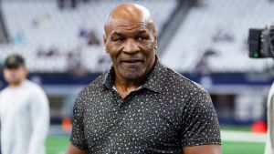 Sep 15, 2024; Arlington, Texas, USA; Boxer Mike Tyson on the field before the game between the Dallas Cowboys and New Orleans Saints at AT&T Stadium.