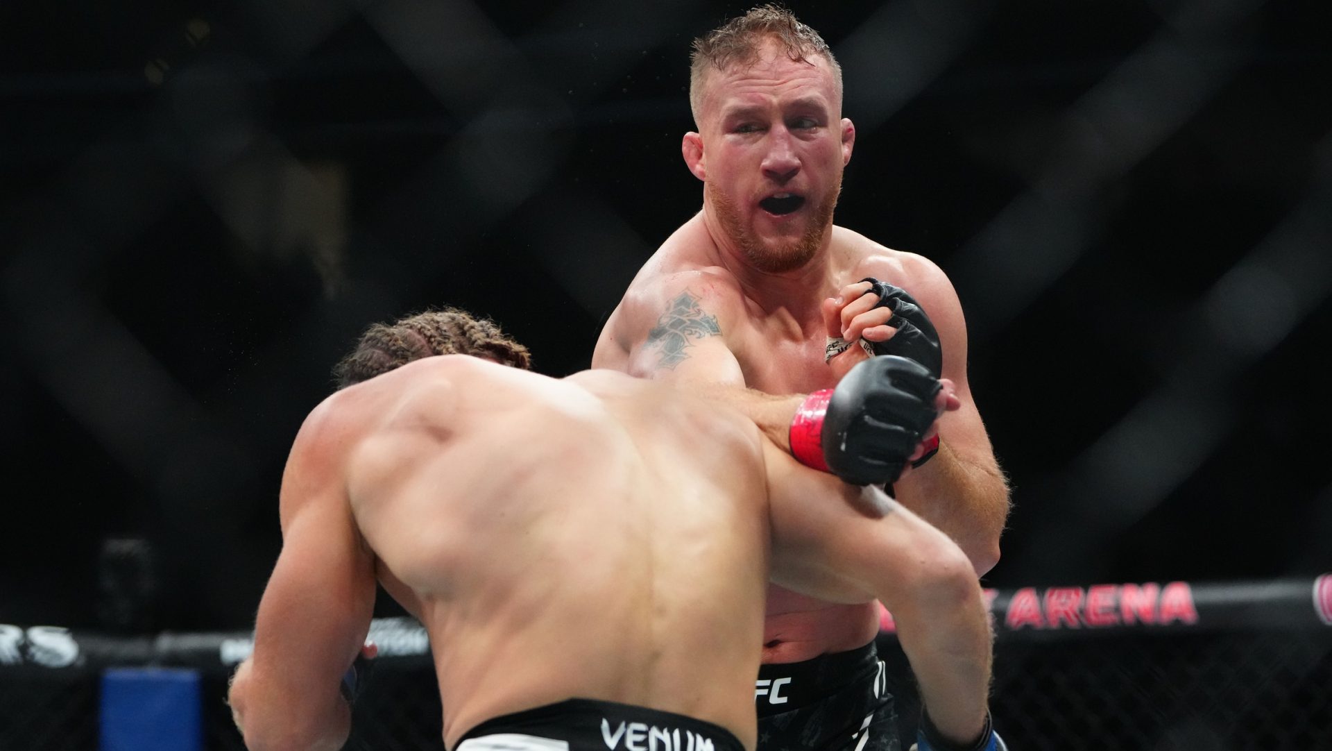 Mar 8, 2025; Las Vegas, Nevada, USA; Justin Gaethje (red gloves) fights Rafael Fiziev (blue gloves) during UFC 313 at T-Mobile Arena. Mandatory Credit: Stephen R. Sylvanie-Imagn Images