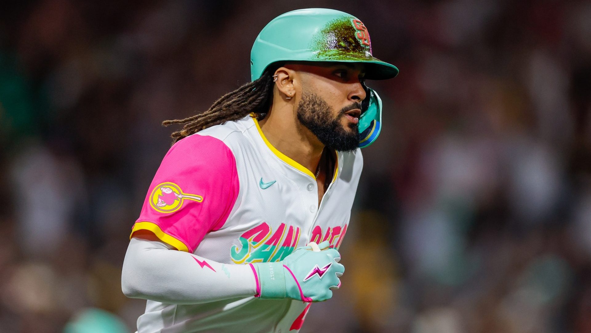 Sep 26, 2025; San Diego, California, USA; San Diego Padres right fielder Fernando Tatis Jr. (23) hits a grand slam home run during the fourth inning Arizona Diamondbacks at Petco Park