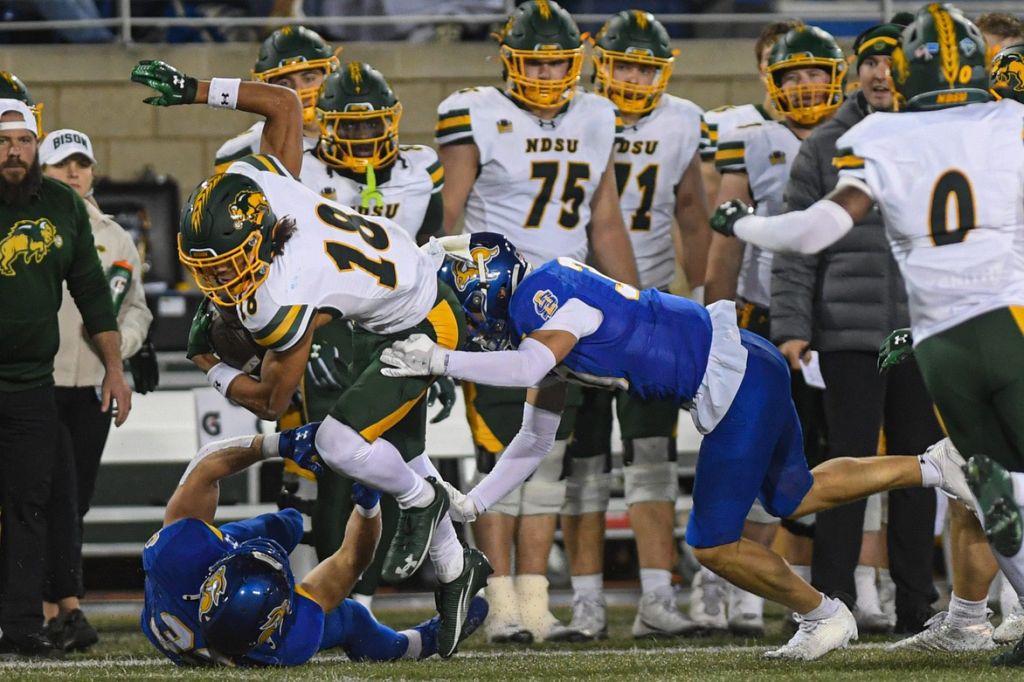 North Dakota State Bison wide receiver Jackson Williams (18) gets tackled on the sideline while playing against the South Dakota State Jackrabbits on Saturday, Oct. 25, 2025, at Dana J. Dykhouse Stadium in Brookings, South Dakota.