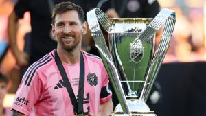 Dec 6, 2025; Fort Lauderdale, Florida, USA; Inter Miami forward Lionel Messi (10) looks on with the Philip F. Anschutz trophy after winning the 2025 MLS Cup against the Vancouver Whitecaps FC at Chase Stadium.