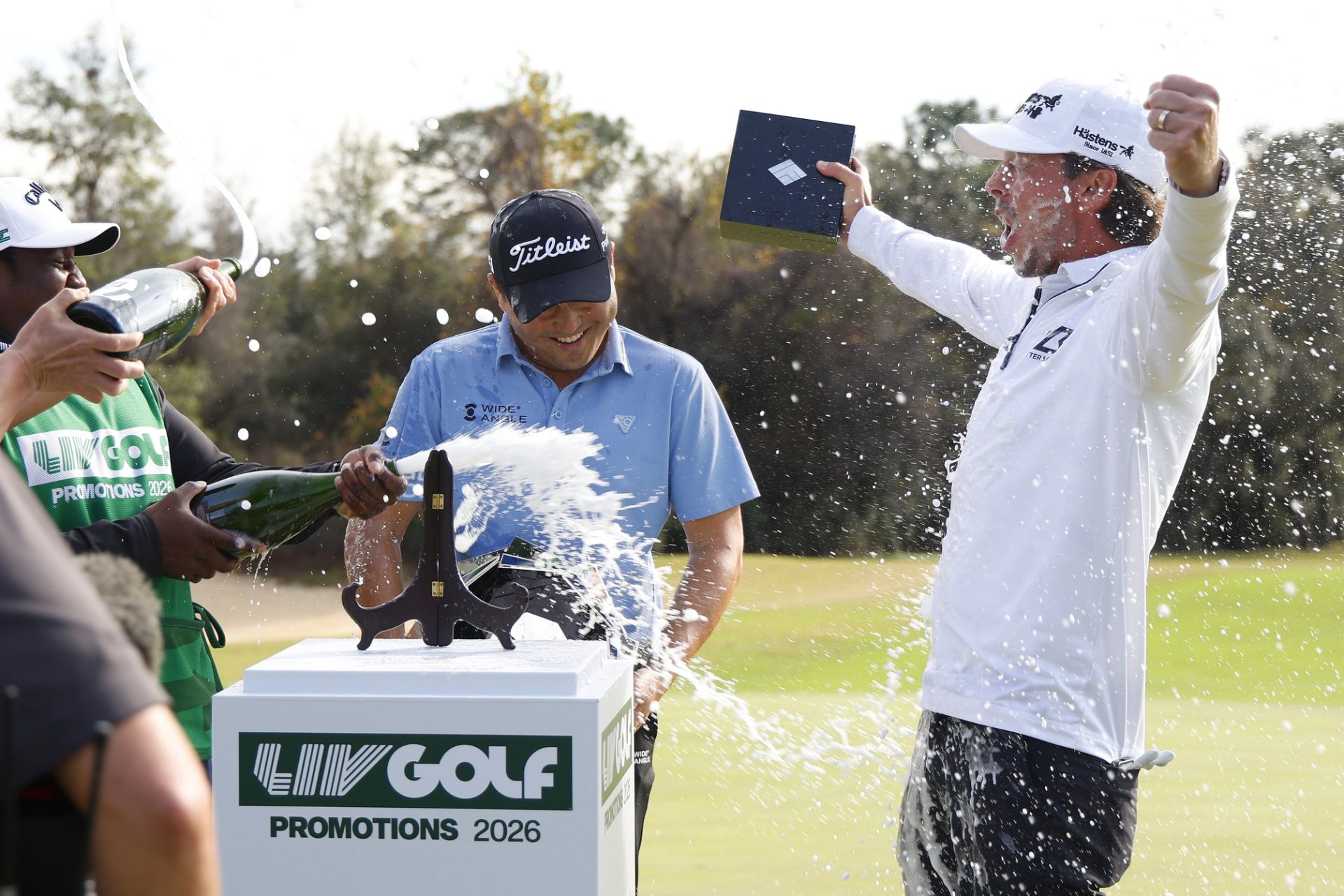 Jan 11, 2026; Lecanto, Florida, United States; Richard T. Lee and Bjorn Hellgren are sprayed with Champagne after taking the top two spots in the LIV Golf Black Diamond Ranch Propmotions golf tournament at Black Diamond Ranch.