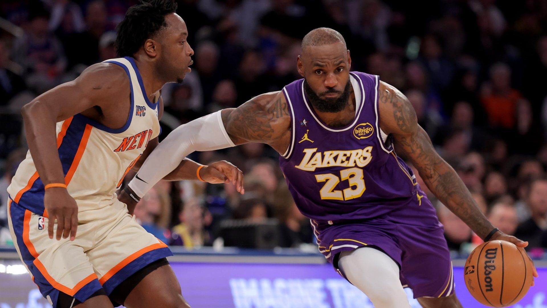 Feb 1, 2026; New York, New York, USA; Los Angeles Lakers forward LeBron James (23) drives to the basket against New York Knicks forward OG Anunoby (8) during the third quarter at Madison Square Garden.