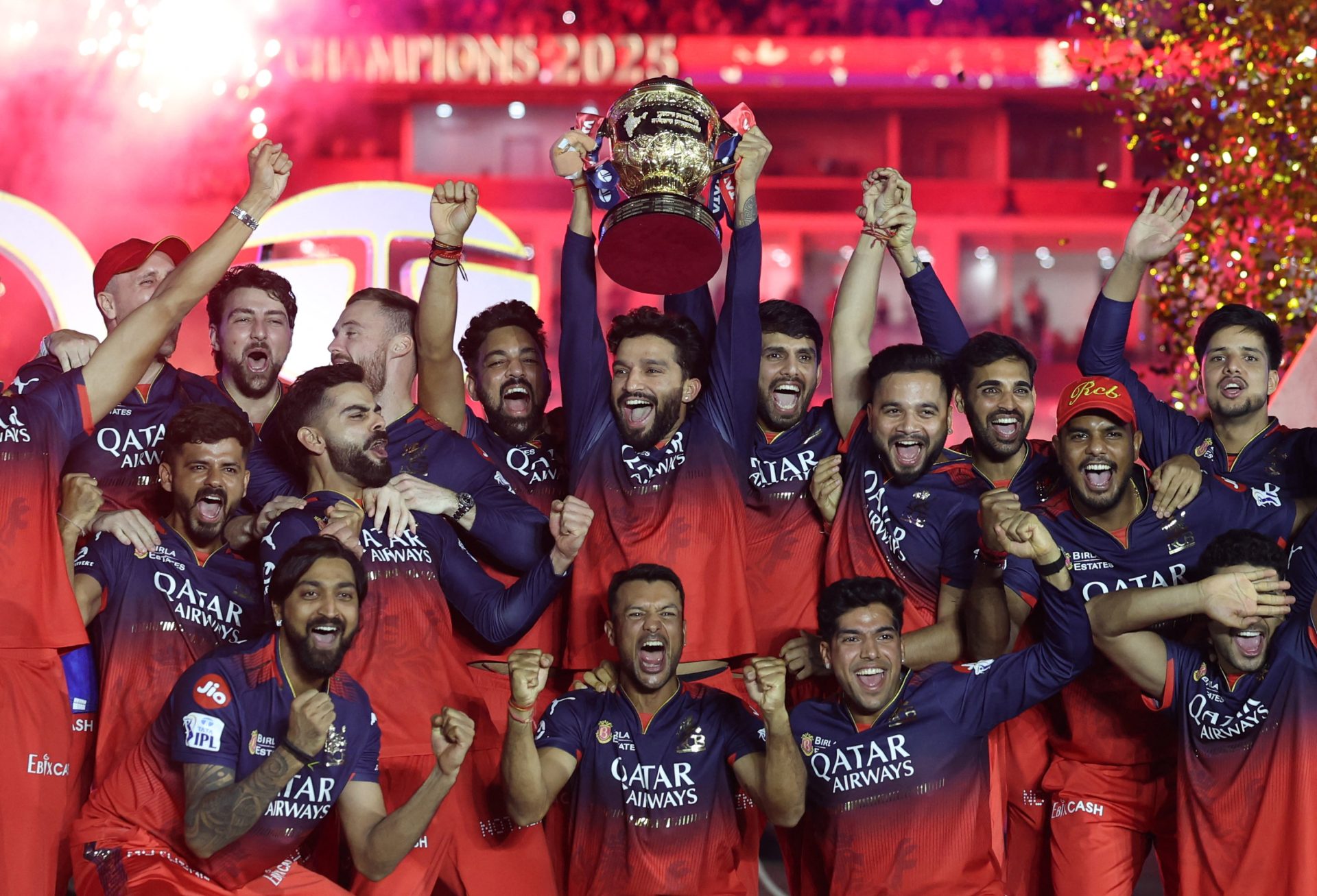 Cricket - Indian Premier League - IPL - Final - Royal Challengers Bengaluru v Punjab Kings - Narendra Modi Stadium, Ahmedabad, India - June 4, 2025 Royal Challengers Bengaluru's Rajat Patidar lifts the trophy as he celebrates with teammates after winning the Indian Premier League