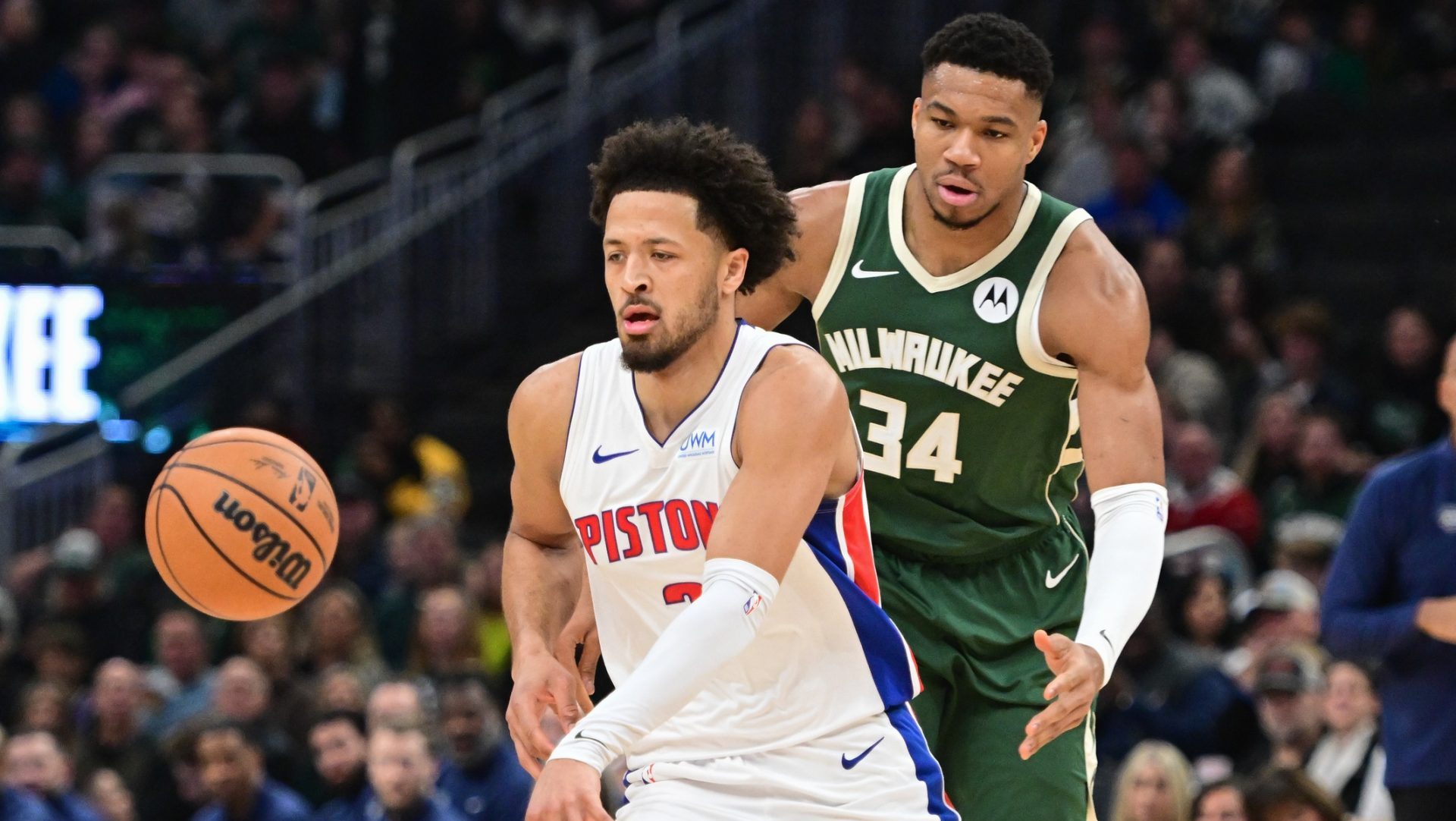 Dec 16, 2023; Milwaukee, Wisconsin, USA; Detroit Pistons guard Cade Cunningham (2) is guarded by Milwaukee Bucks forward Giannis Antetokounmpo (34) in the first quarter at Fiserv Forum. Mandatory Credit: Benny Sieu-USA TODAY Sports