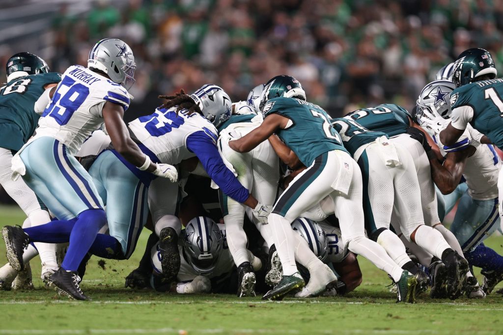 Sep 4, 2025; Philadelphia, Pennsylvania, USA; The Philadelphia Eagles execute a tush push for a first down against the Dallas Cowboys during the fourth quarter of the game at Lincoln Financial Field.