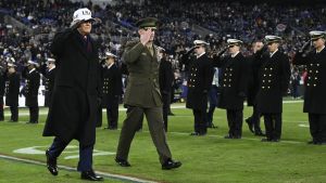 Dec 13, 2025; Baltimore, Maryland, USA; President Donald J Trump cross the field at half time of the game between the Navy Midshipmen and the Army West Point Black Knights at M&T Bank Stadium.