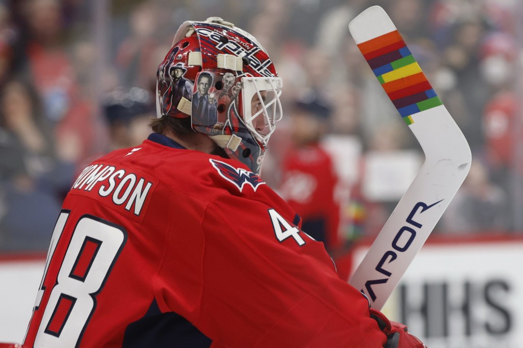 Jan 17, 2026; Washington, District of Columbia, USA; Washington Capitals goaltender Logan Thompson (48) displays rainbow tape on his stick during warmup as part of Pride Night against the Florida Panthers at Capital One Arena