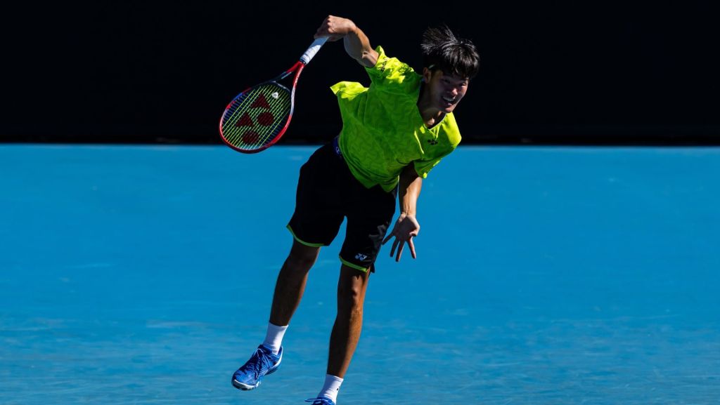 Jan 18, 2026; Melbourne, Victoria, Australia; Michael Zheng of United States in action against Sebastian Korda of United States in the first round of the men’s singles at the Australian Open at Kia Arena in Melbourne Park. Mandatory Credit: