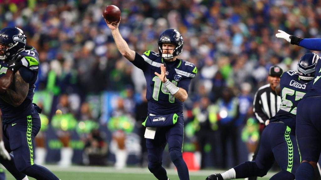 Jan 25, 2026; Seattle, WA, USA; Seattle Seahawks quarterback Sam Darnold (14) passes against the Los Angeles Rams during the first half in the 2026 NFC Championship Game at Lumen Field.