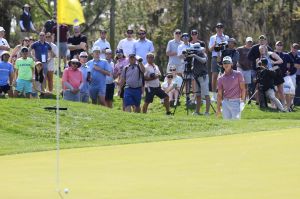 Min Woo Lee watches his chip from a bunker on on the fourth hole during the third round of The Players Championship PGA golf tournment Saturday, March 15, 2025 at TPC Sawgrass in Ponte Vedra Beach, Fla.