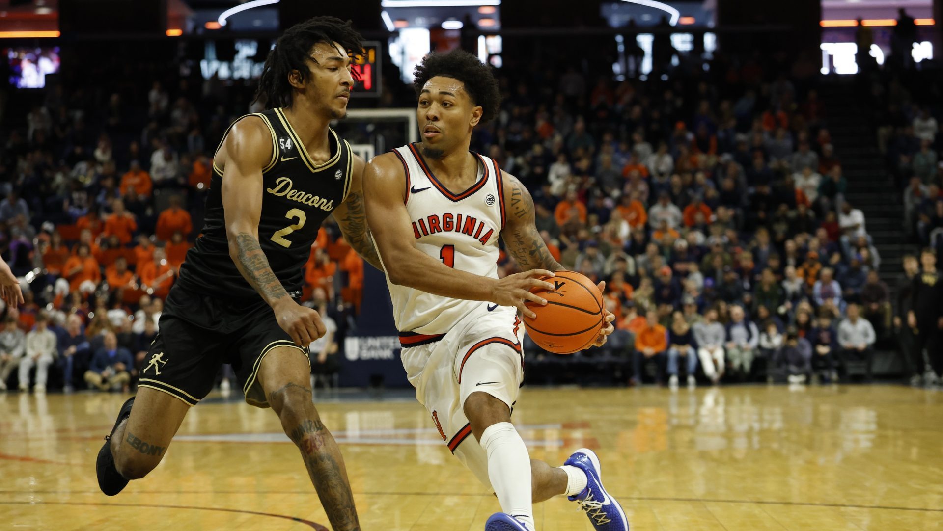 Mar 3, 2026; Charlottesville, Virginia, USA; Virginia Cavaliers guard Malik Thomas (1) drives to the basket as Wake Forest Demon Deacons forward Juke Harris (2) defends in the second half at John Paul Jones Arena.