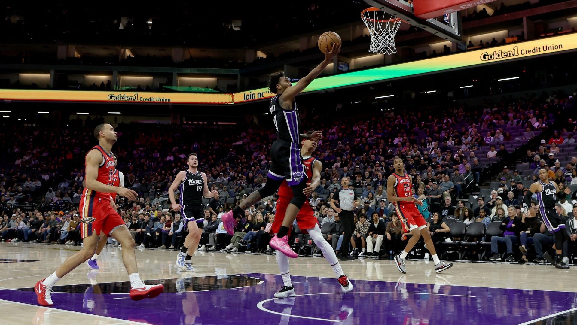 Mar 5, 2026; Sacramento, California, USA; Sacramento Kings guard Malik Monk (0) makes a layup against the New Orleans Pelicans during the fourth quarter at Golden 1 Center.