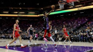 Mar 5, 2026; Sacramento, California, USA; Sacramento Kings guard Malik Monk (0) makes a layup against the New Orleans Pelicans during the fourth quarter at Golden 1 Center.