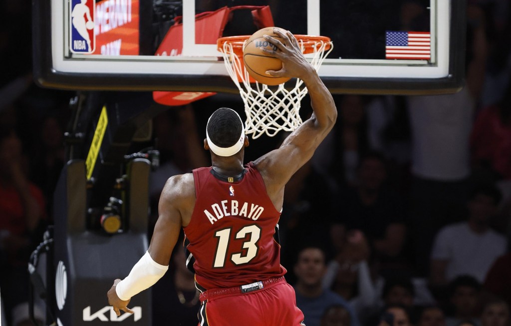 Mar 10, 2026; Miami, Florida, USA; Miami Heat center Bam Adebayo (13) dunks against the Washington Wizards during the second half at Kaseya Center.