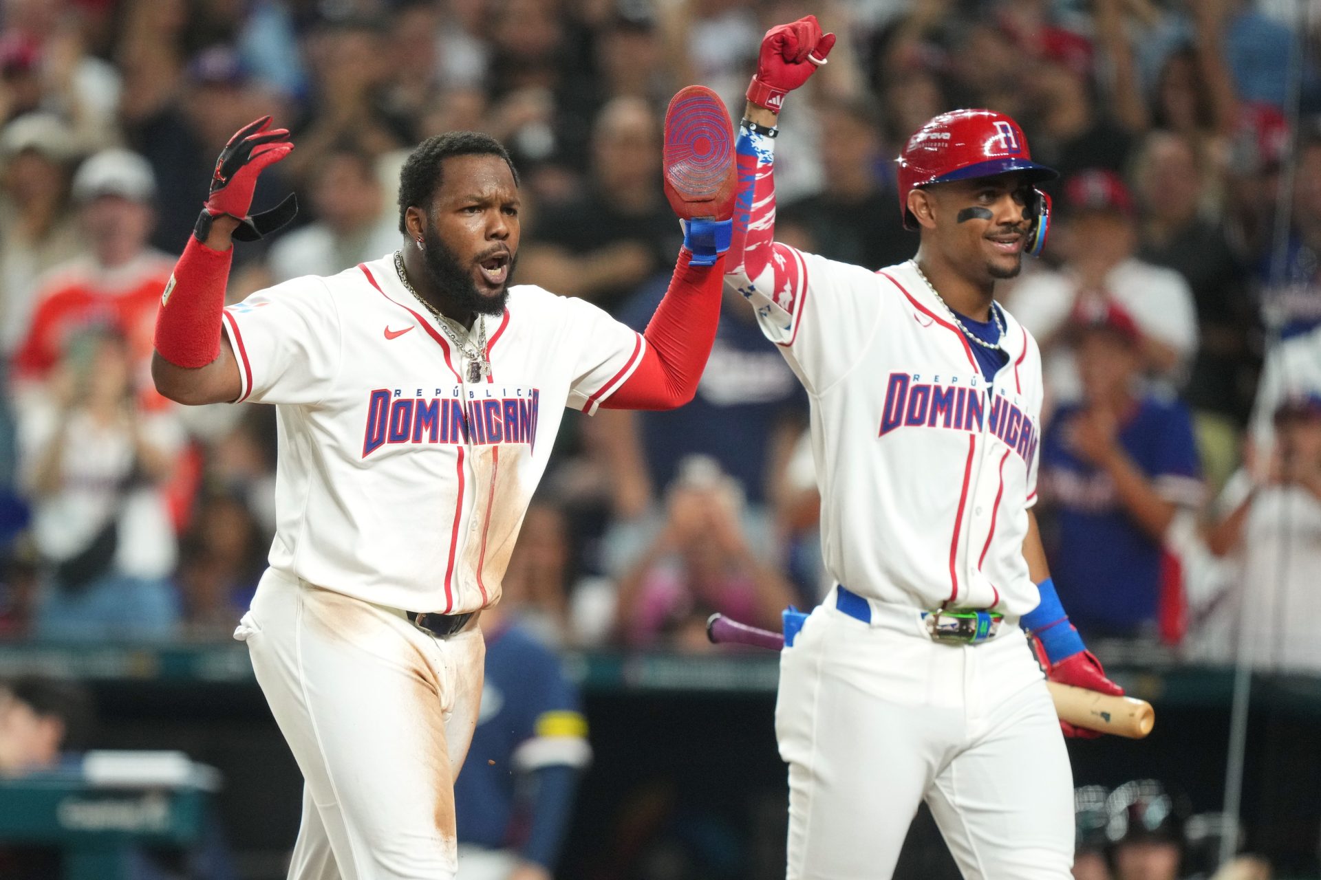 Mar 13, 2026; Miami, FL, United States; Dominican Republic first baseman Vladimir Guerrero Jr., left, and center fielder Julio Rodrguez celebrate scoring a run against the Korea in the second inning during a quarterfinal game of the 2026 World Baseball Classic at loanDepot Park.