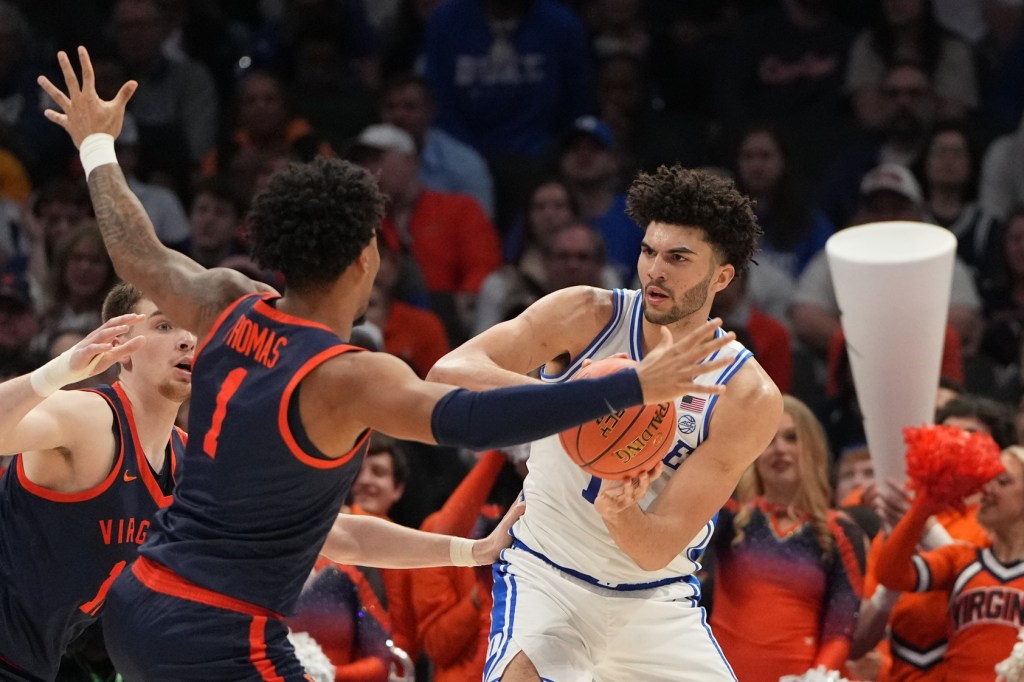 Mar 14, 2026; Charlotte, NC, USA; Duke Blue Devils forward Cameron Boozer (12) defends as Virginia Cavaliers guard Malik Thomas (1) defends in the first half during the men's ACC Conference Tournament Championship at Spectrum Center.