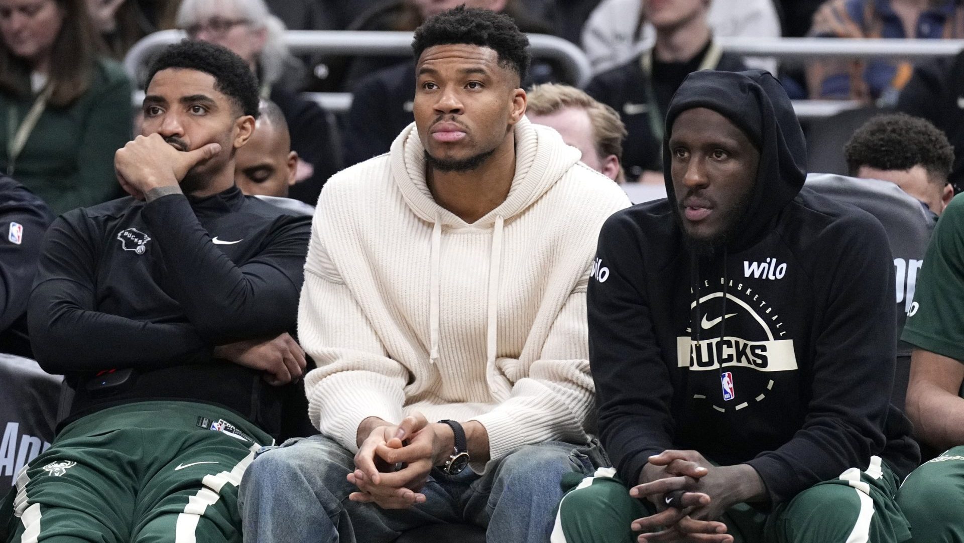 Mar 17, 2026; Milwaukee, Wisconsin, USA; Milwaukee Bucks guard Gary Harris (11), left, Milwaukee Bucks forward Giannis Antetokounmpo (34) and Milwaukee Bucks forward Taurean Prince (12) watch the game against the Cleveland Cavaliers from the bench in the second half at Fiserv Forum. Mandatory Credit: Michael McLoone-Imagn Images