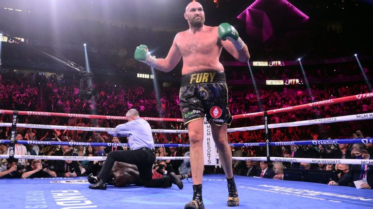 Oct 9, 2021; Las Vegas, Nevada, USA; Deontay Wilder (red/black trunks) is knocked out by Tyson Fury (black/gold trunks) during their WBC/Lineal heavyweight championship boxing match at T-Mobile Arena. Mandatory Credit: Joe Camporeale-USA TODAY Sports