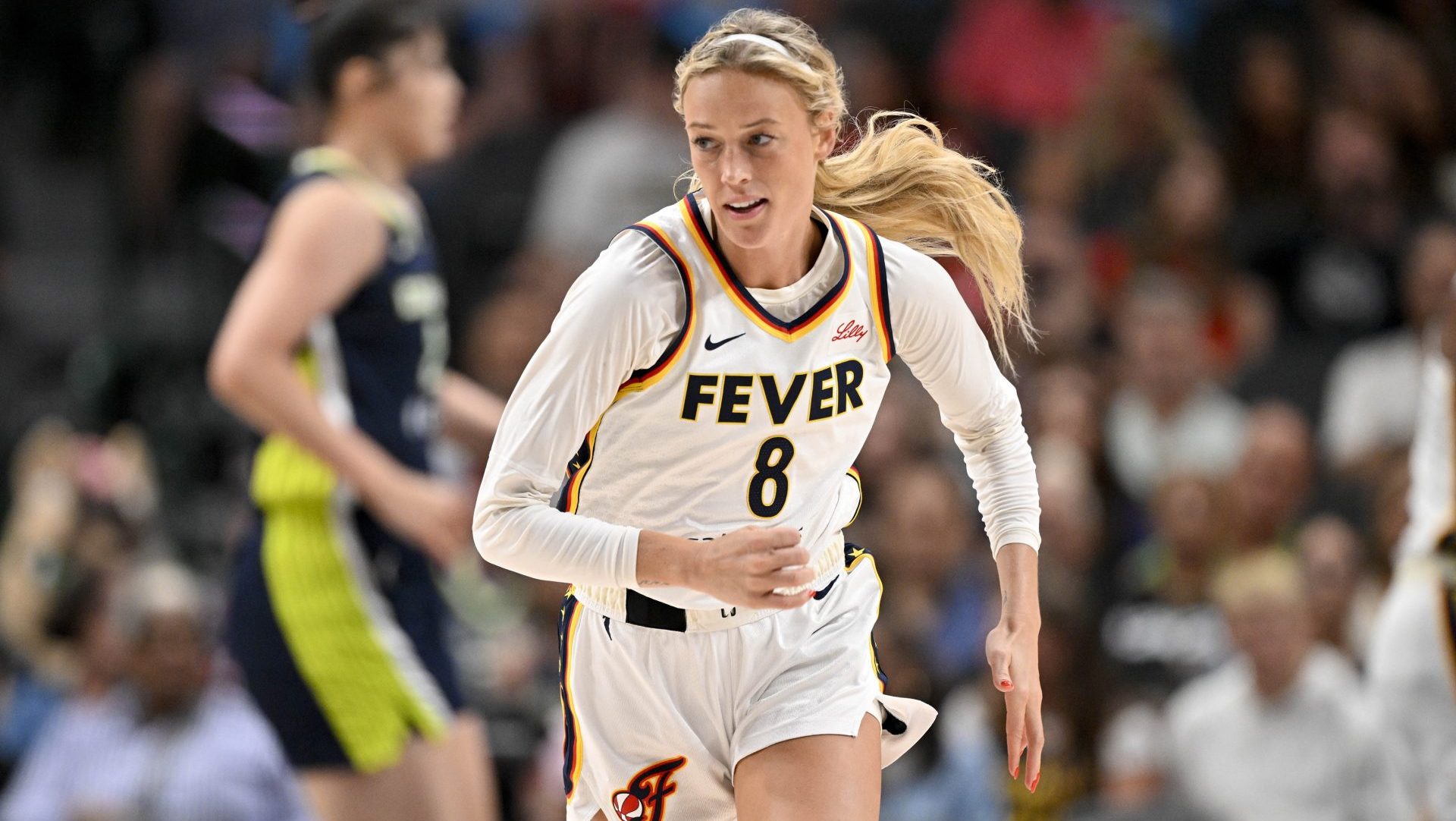 Aug 1, 2025; Dallas, Texas, USA; Indiana Fever guard Sophie Cunningham (8) runs back up the court during the second half against the Dallas Wings at the American Airlines Center. Mandatory Credit: Jerome Miron-Imagn Images