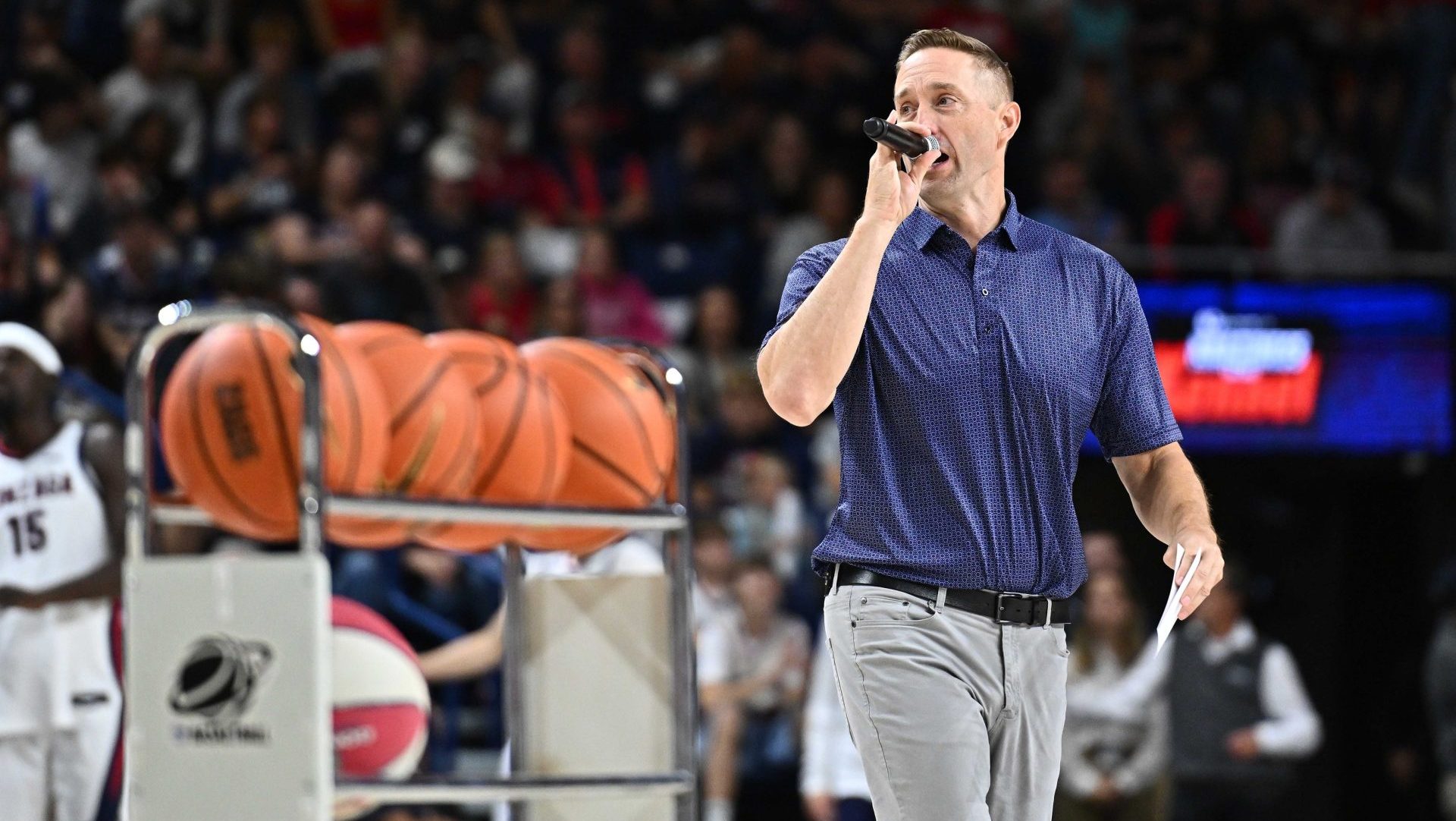 Oct 4, 2025; Spokane, WA, USA; ESPN college basketball analyst Sean Farnham emcees during Numerica Kraziness in the Kennel at the McCarthey Athletic Center