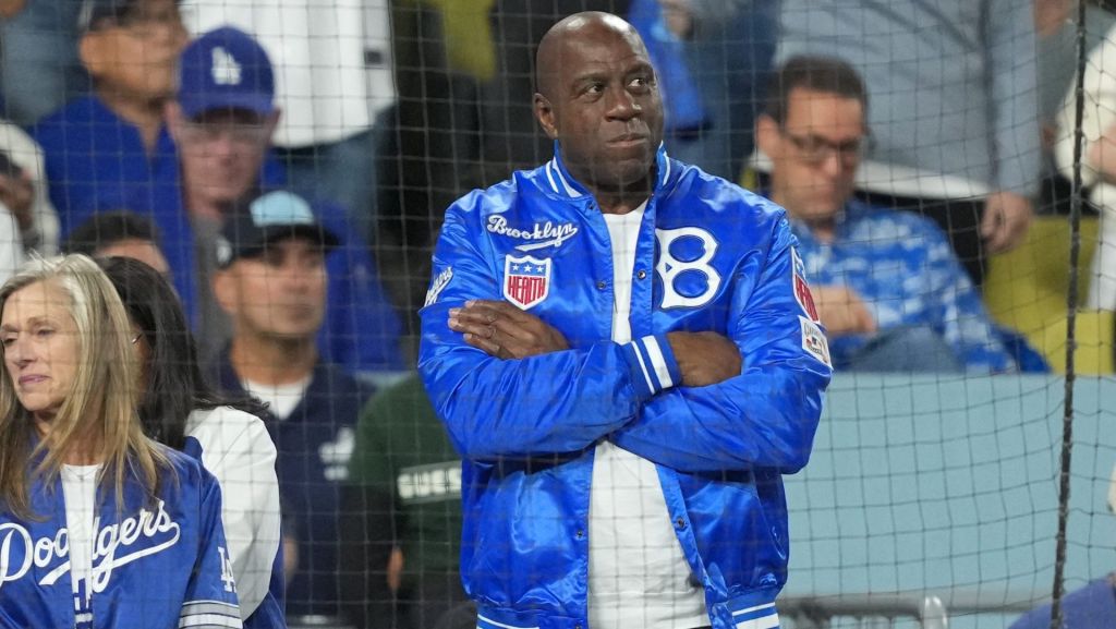 Oct 17, 2025; Los Angeles, California, USA; Los Angeles Dodgers co-owner Magic Johnson looks on in the sixth inning between the Los Angeles Dodgers and the Milwaukee Brewers during game four of the NLCS round for the 2025 MLB playoffs at Dodger Stadium