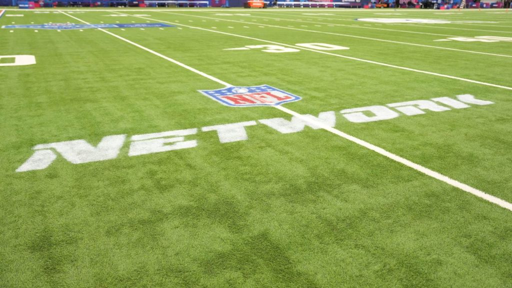 Feb 27, 2026; Indianapolis, IN, USA; The NFL Network logo on the field during the NFL Scouting Combine at Lucas Oil Stadium. Mandatory Credit: Kirby Lee-Imagn Images