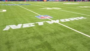 Feb 27, 2026; Indianapolis, IN, USA; The NFL Network logo on the field during the NFL Scouting Combine at Lucas Oil Stadium. Mandatory Credit: Kirby Lee-Imagn Images