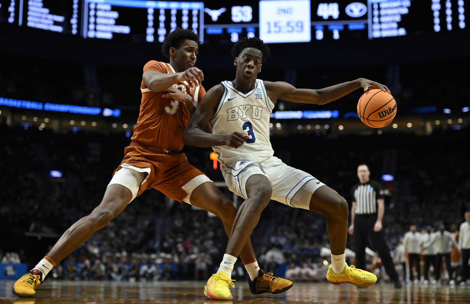 Mar 19, 2026; Portland, OR, USA; BYU Cougars forward AJ Dybantsa (3) dribbles against Texas Longhorns forward Dailyn Swain (3) in the second half during a first round game of the men's 2026 NCAA Tournament at Moda Center.