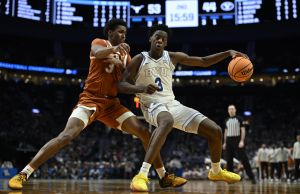 Mar 19, 2026; Portland, OR, USA; BYU Cougars forward AJ Dybantsa (3) dribbles against Texas Longhorns forward Dailyn Swain (3) in the second half during a first round game of the men's 2026 NCAA Tournament at Moda Center.