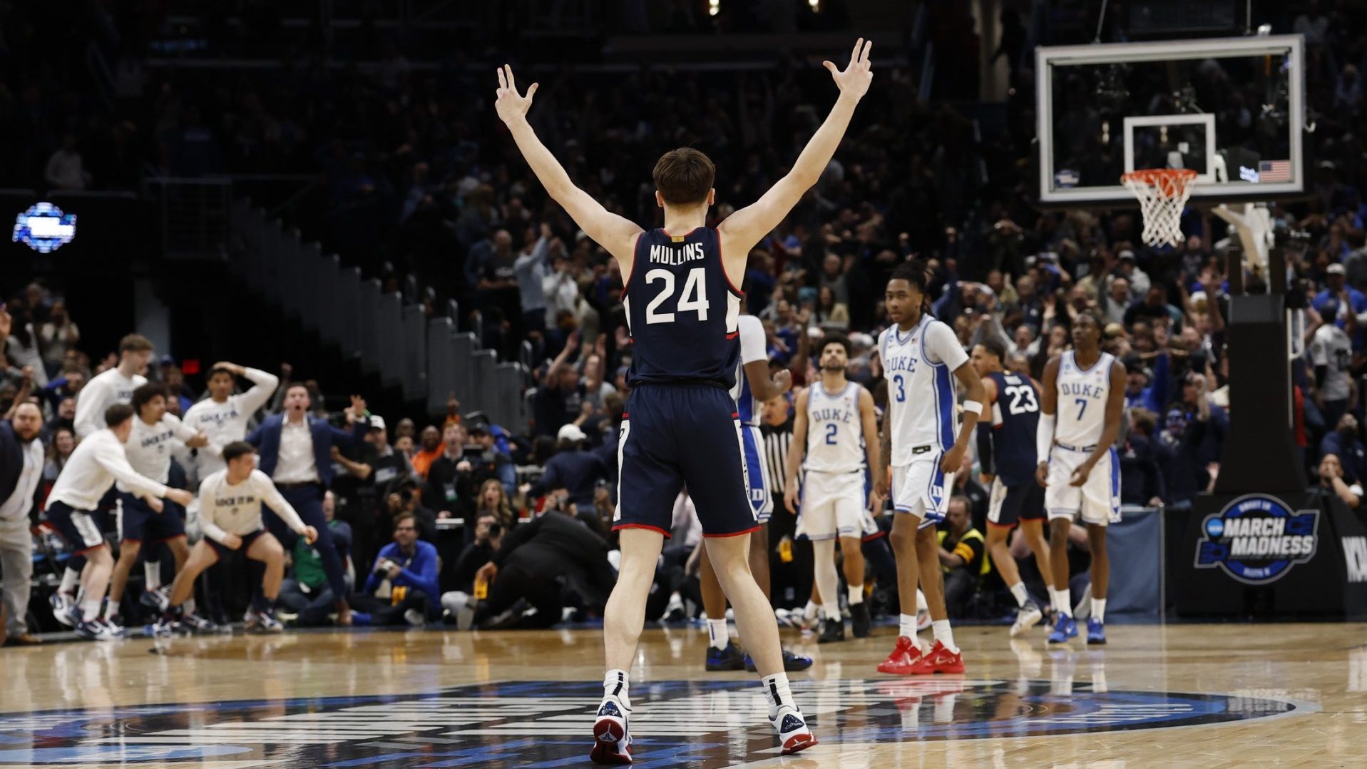 Mar 29, 2026; Washington, DC, USA; UConn Huskies guard Braylon Mullins (24) celebrates after making the game-winning three-point basket against the Duke Blue Devils in the second half during an Elite Eight game of the East Regional of the men's 2026 NCAA Tournament at Capital One Arena