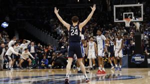 Mar 29, 2026; Washington, DC, USA; UConn Huskies guard Braylon Mullins (24) celebrates after making the game-winning three-point basket against the Duke Blue Devils in the second half during an Elite Eight game of the East Regional of the men's 2026 NCAA Tournament at Capital One Arena