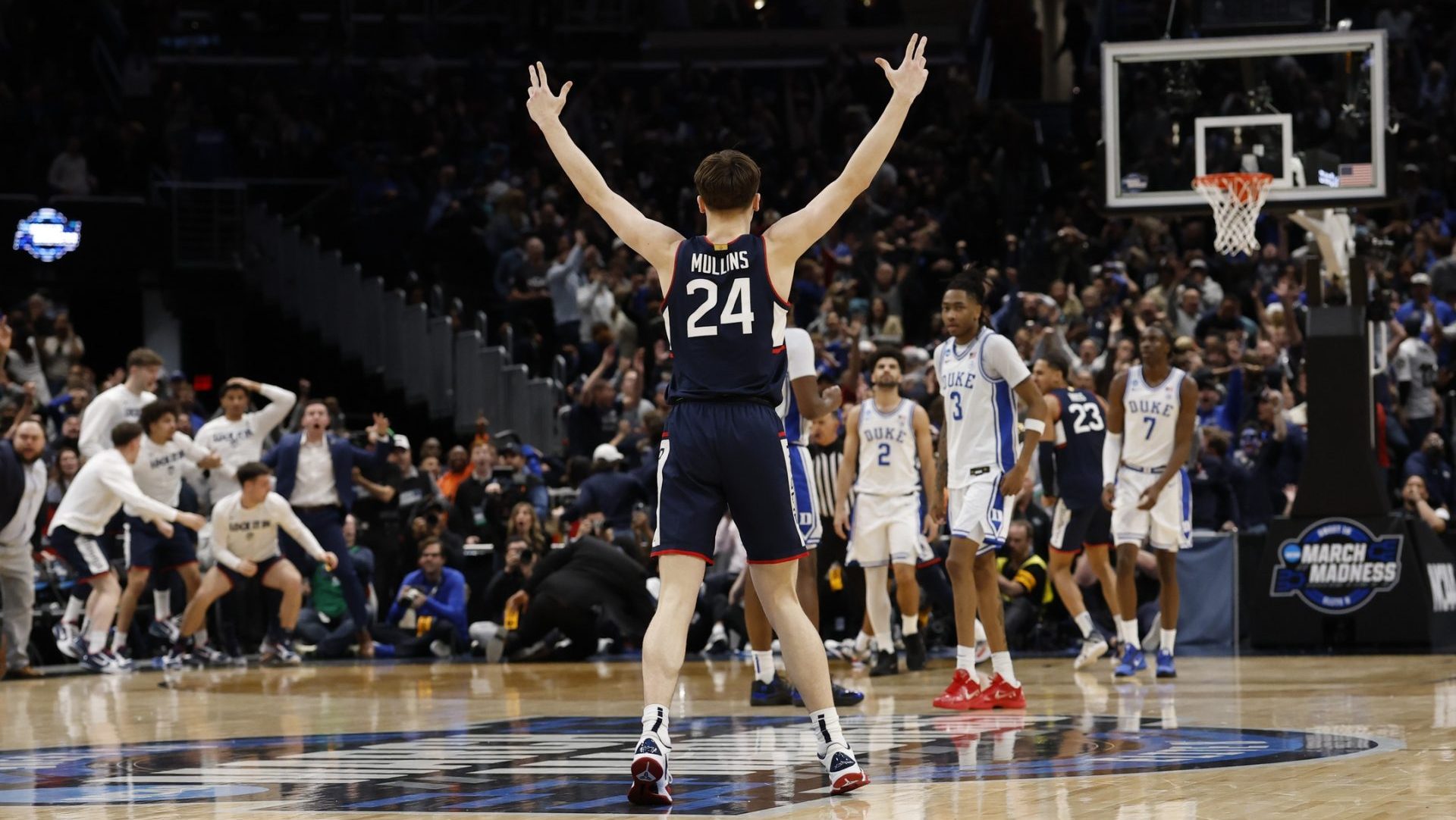 Mar 29, 2026; Washington, DC, USA; UConn Huskies guard Braylon Mullins (24) celebrates after making the game-winning three-point basket against the Duke Blue Devils in the second half during an Elite Eight game of the East Regional of the men's 2026 NCAA Tournament at Capital One Arena. Mandatory Credit: Geoff Burke-Imagn Images