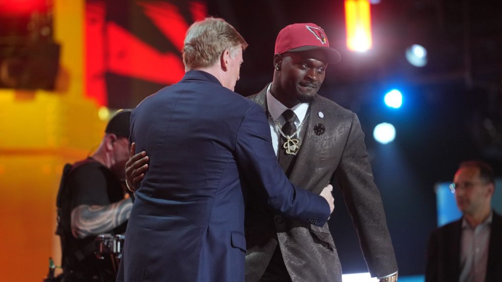 Apr 23, 2026; Pittsburgh, PA, USA; Notre Dame Fighting Irish running back Jeremiyah Love embraces NFL commissioner Roger Goodell after he is selected by the Arizona Cardinals as the number three pick during the 2026 NFL Draft at Acrisure Stadium.