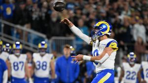 Jan 10, 2026; Charlotte, NC, USA; Los Angeles Rams quarterback Matthew Stafford (9) drops back to pass against the Carolina Panthers in the first half during the NFC Wild Card Round game at Bank of America Stadium.