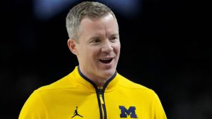 Michigan Wolverines head coach Dusty May talks with his team Monday, April 6, 2026, during the NCAA men's basketball tournament national championship game against the UConn Huskies at Lucas Oil Stadium in Indianapolis.