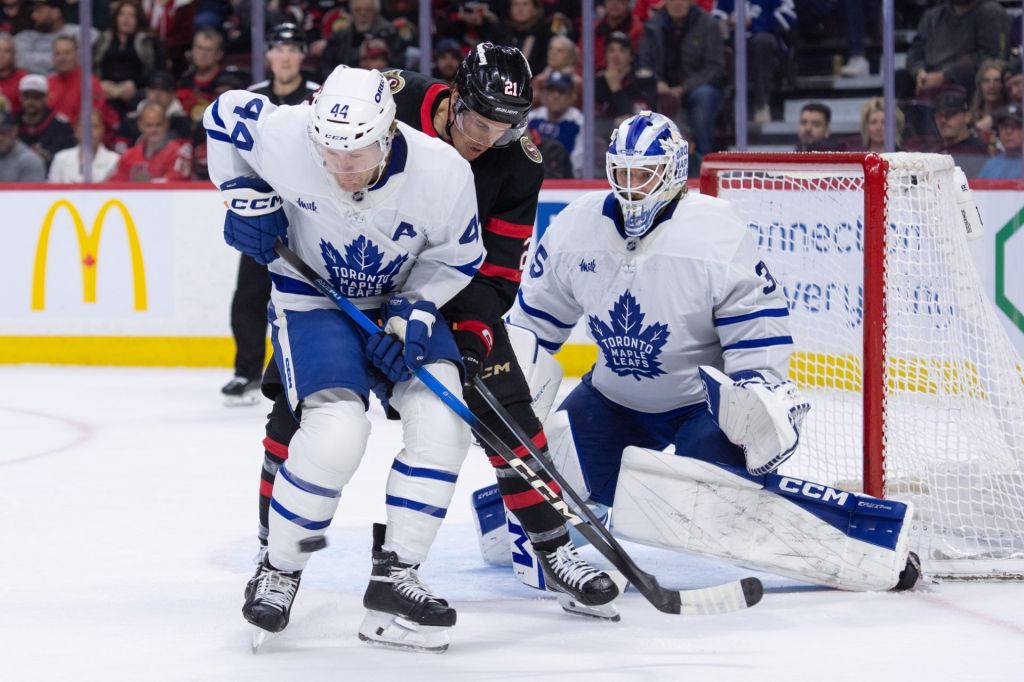 Apr 15, 2026; Ottawa, Ontario, CAN; Toronto Maple Leafs defenseman Morgan Reilly (44) blocks a shot as he battles with Ottawa Senators center Nick Cousions (21) in the first period at the Canadian Tire Centre.