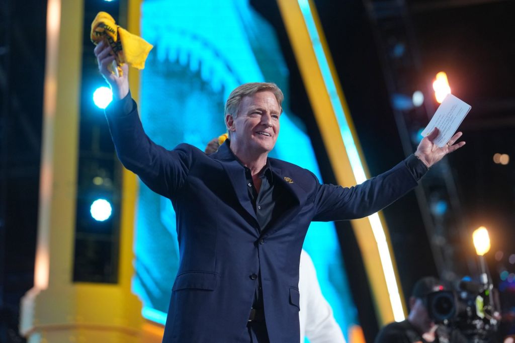 Apr 23, 2026; Pittsburgh, PA, USA; NFL commissioner Roger Goodell holds a Terrible Towel during the 2026 NFL Draft at Acrisure Stadium.