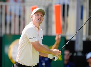 Apr 30, 2026; Miami, Florida, USA; Justin Rose watches his tee shot on the first hole during the first round of the Cadillac Championship golf tournament.