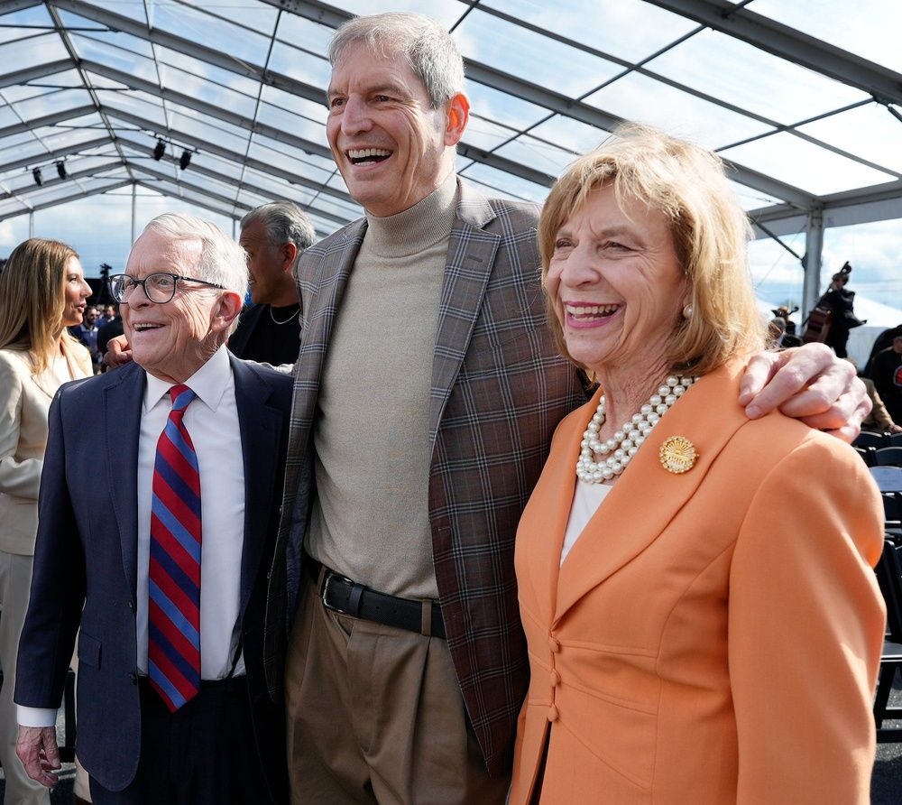 Ohio Gov. Mike DeWine, former Browns quarterback Bernie Kosar and first lady Fran DeWine pose for a photo at the Cleveland Browns groundbreaking ceremony for the new Huntington Bank Field in Brook Park on April 30, 2026. 