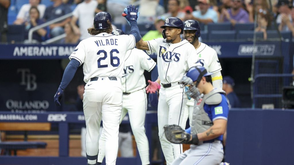 May 4, 2026; St. Petersburg, Florida, USA; Tampa Bay Rays left fielder Chandler Simpson (14) greets right fielder Ryan Vilade (26) at home plate after hitting a three-run home run against the Toronto Blue Jays in the first inning at Tropicana Field.