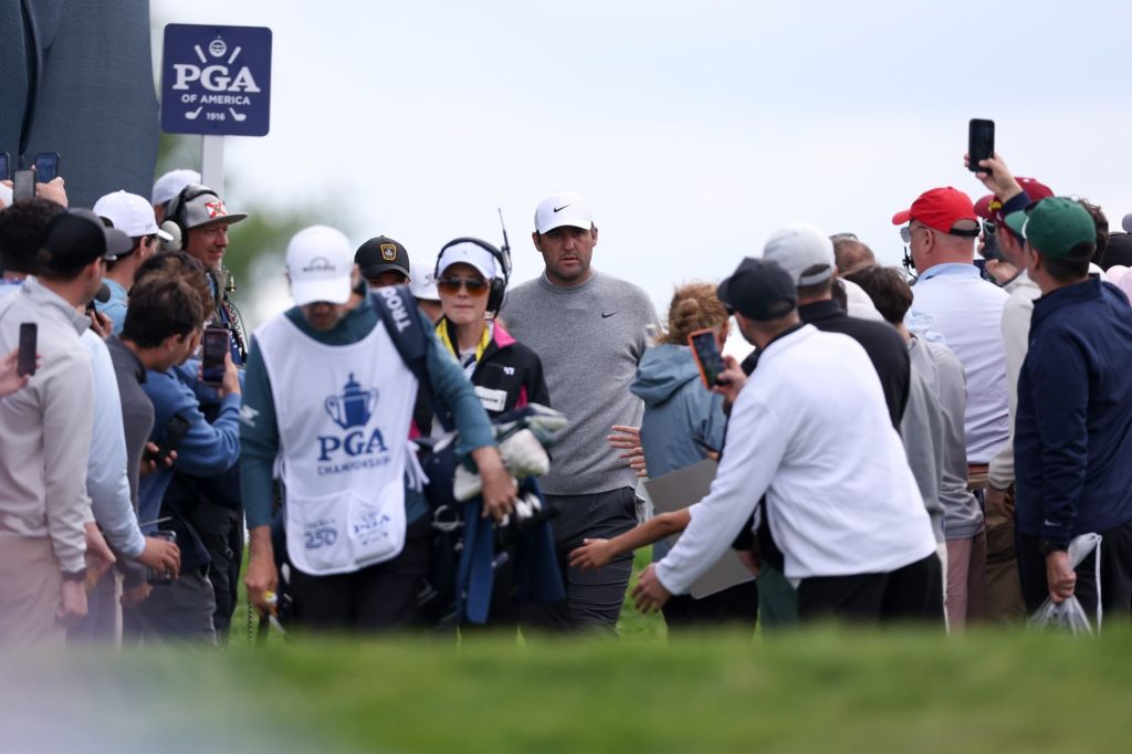May 14, 2026; Newtown Square, Pennsylvania, USA; Scottie Scheffler walks past fans to the seventh tee during the first round of the PGA Championship golf tournament at Aronimink Golf Club.
