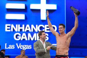 May 24, 2026; Las Vegas, NV, USA; Kristian Gkolomeev (GRE) poses with Enhanced co-founder Max Martin after setting a world record in the 50m freestyle of 21.81 during the Enhanced Games at Resorts World Las Vegas.