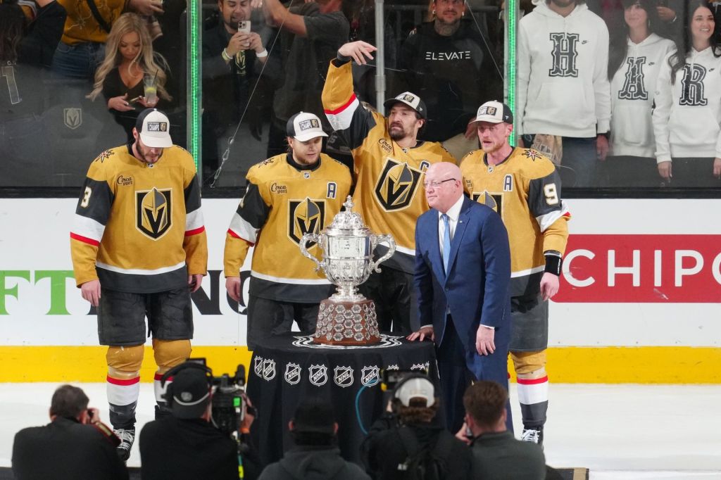 May 26, 2026; Las Vegas, Nevada, USA; Vegas Golden Knights are presented with the Clarence S. Campbell Bowl by Deputy commissioner of the NHL Bill Daly after winning against the Colorado Avalanchein game four of the Western Conference Final of the 2026 Stanley Cup Playoffs at T-Mobile Arena.