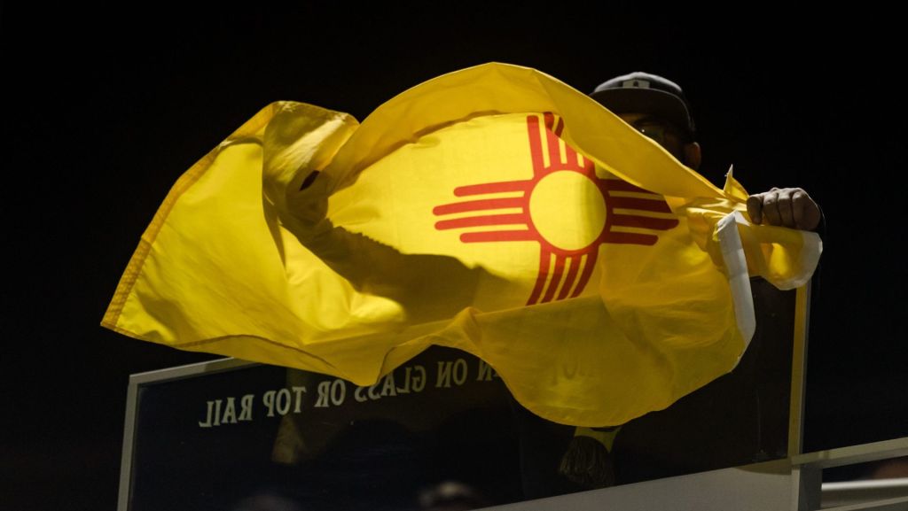 New Mexico United fans wave the team's flag at the Locomotive's home opener game Saturday, March 19, 2022, at Southwest Univerity Park in El Paso, Texas.