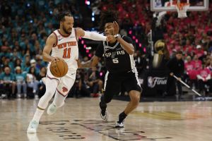 Jun 3, 2026; San Antonio, Texas, USA; New York Knicks guard Jalen Brunson (11) dribbles the ball past San Antonio Spurs guard Stephon Castle (5) in the first half during game one of the 2026 NBA Finals at Frost Bank Center.