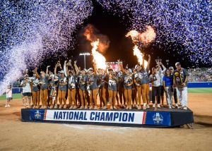 Jun 4, 2026; Oklahoma City, OK, USA; Texas Longhorns players and coaches pose for a group photo after defeating the Texas Tech Red Raiders to win the NCAA WomenÕs College World Series championship series at Devon Park.
