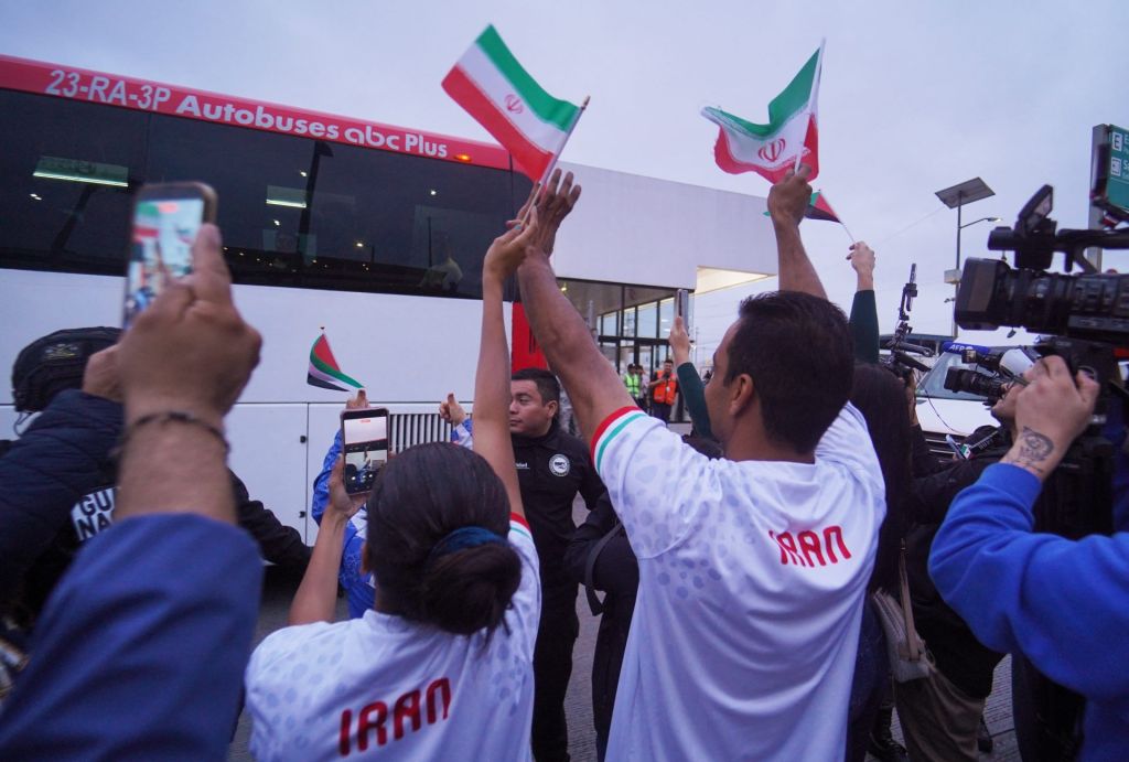 FIFA World Cup 2026 - Team Iran arrives at Tijuana for World Cup - Tijuana International Airport, Tijuana, Mexico - June 7, 2026 Iran fans look on as the bus arrives